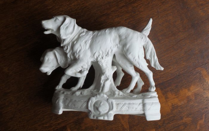 Biscuit porcelain sculpture of two hunting dogs
