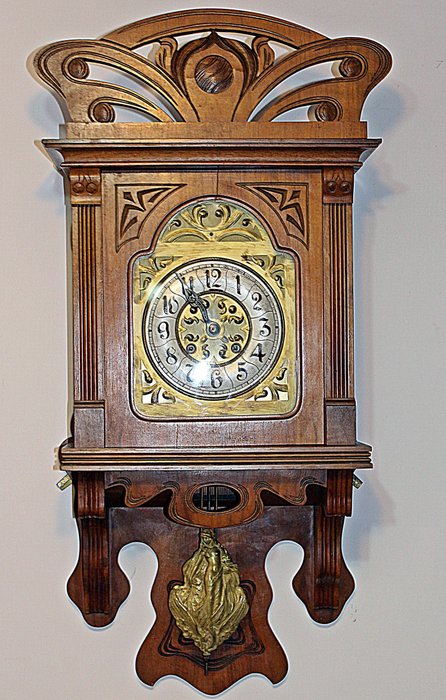 Gustav Becker - A large Art Nouveau wall clock with gilt metal pendulum cast as a female