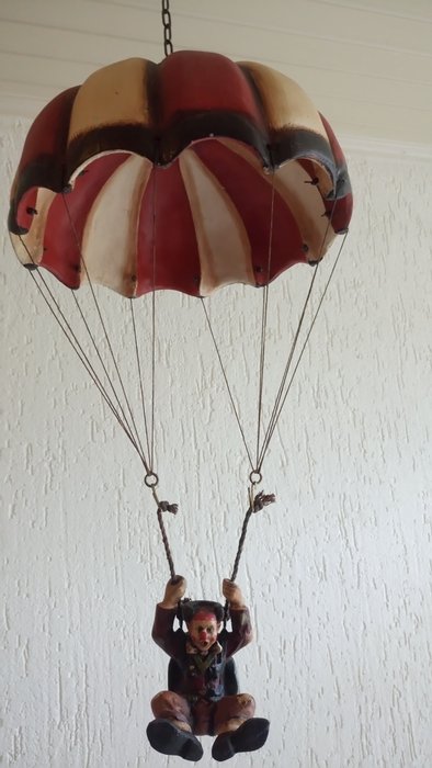 Beautiful decorational piece: a parachutist (clown) suspended from a parachute