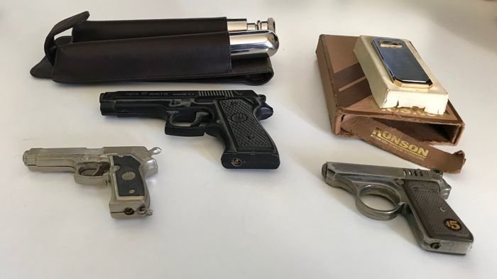 Ronson gas lighter, gold plated and in stainless steel, vintage, from the 1980s + cigar pouch and liquor holder, in leather and pewter, by a German brand + 3 gun-shaped lighters, in mint condition