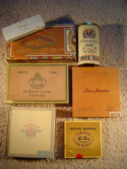Various cigar boxes and old tobacco packages.