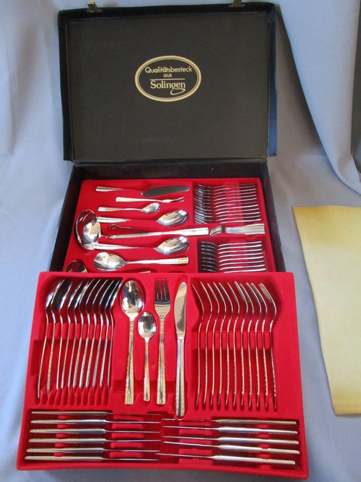 Quality cutlery from Solingen Germany - 12 people (84 parts) - 23/24 carat partially gilded - 1000 fineness - unused - in the suitcase