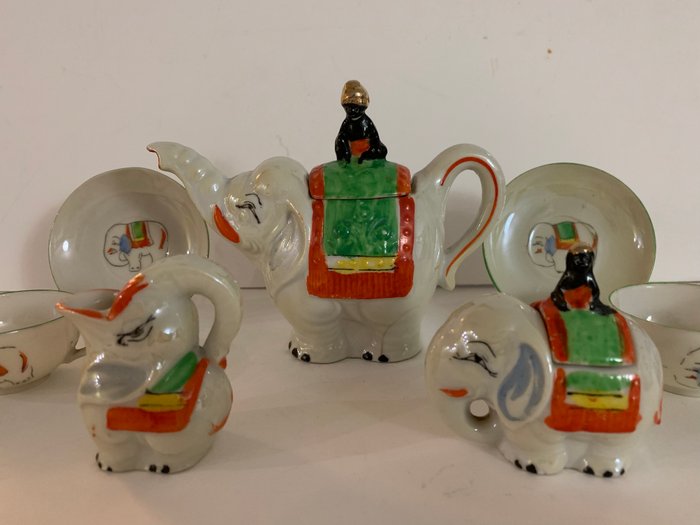 antique children's service with elephants and moraids - Porcelain