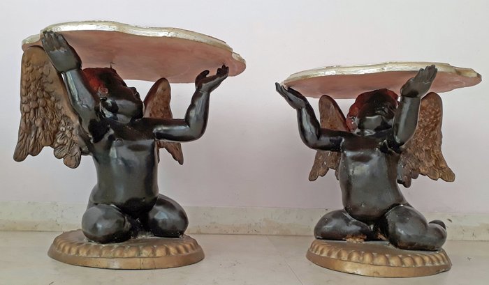 A Pair Of Bronze Cherubs With Diffe, Bronze Cherub Coffee Table