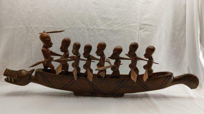 Beautiful African sculpture of a wooden dragon canoe with 8 warriors, Congo
