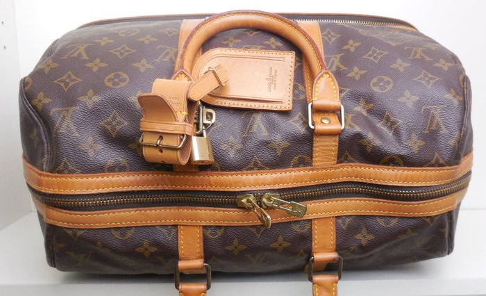 Louis Vuitton - Sac Sport/travelbag+cadena,name tag,handle holder Handbag - Vintage - Catawiki