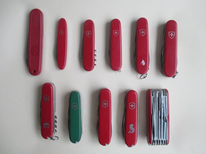 Vintage collection of 11 x Victorinox pocket knives - old models, no longer in production - Solo, Fisherman, watch case opener, Swiss Champ, and others