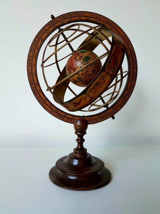 Beautiful Italian globe with a zodiac and protractor mounted on a wooden stand.