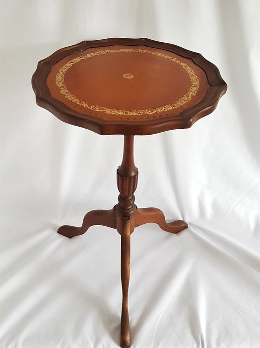Classic wooden side table with inlaid tabletop of leather