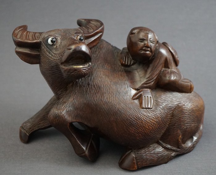 Wooden sculpture of Chinese boy on water buffalo - China - late 20th century