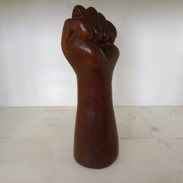 Solid wood carved image of an arm - fist - hand - known as the Figa Fist