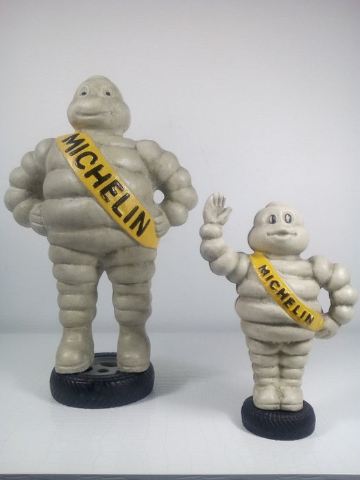 2 Michelin Figures Cast Iron running Michelin 
