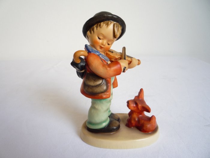 hummel boy playing flute