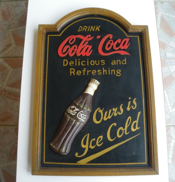 Old advertising board in wood: Drink “COLA COCA”