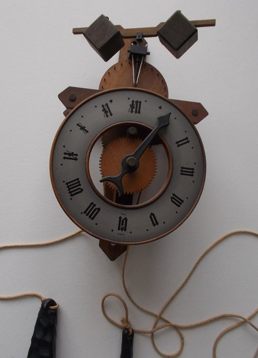 Wooden BUCO  Pendulum Wall Clock by Baumann Ltd of Switzerland.