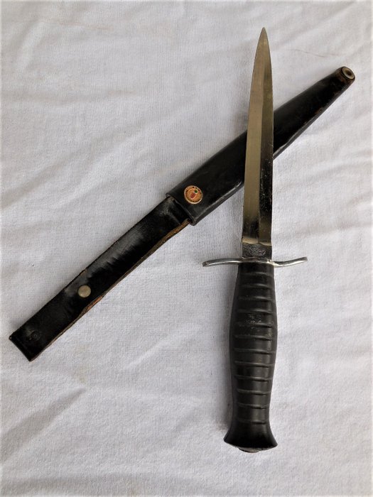 Old Foreign Legion combat knife with bakelite handle and leather scabbard