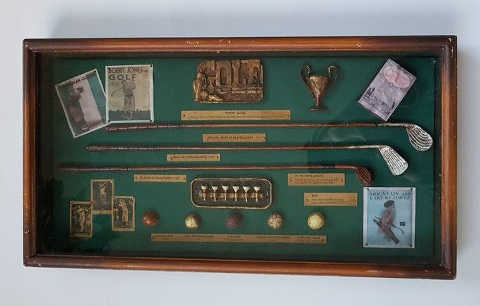Display cabinet with golf memorabilia