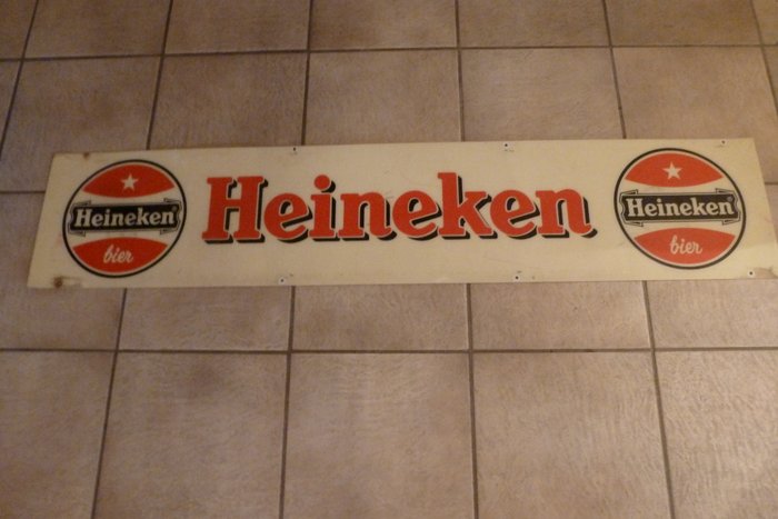 Heineken sign from an old bike rack with the old logo