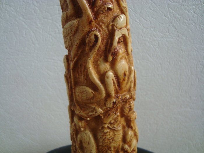 nice reproduction in resin of African animals, a carved tusk of an elephant
