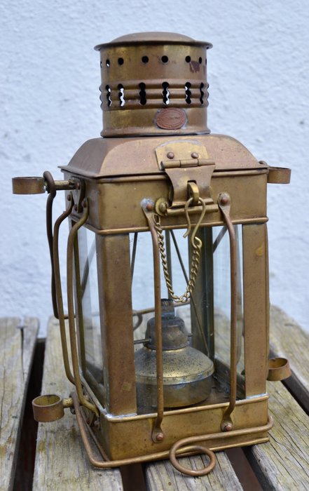 Old brass oil ship lamp given to the first (1St) Class passengers on the SS Nieuw Amsterdam of the Holland America line