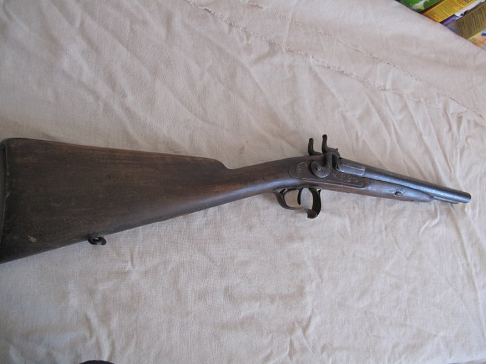 old rifle with hammer fulminate side by side system