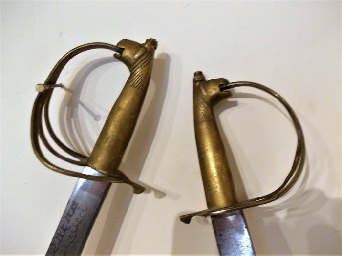 Two swords from India with lion's head handles