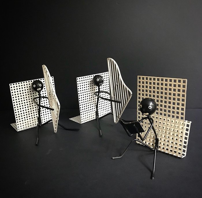 Pilastro - A set of minimalist perforated metal bookends and a letter holder.