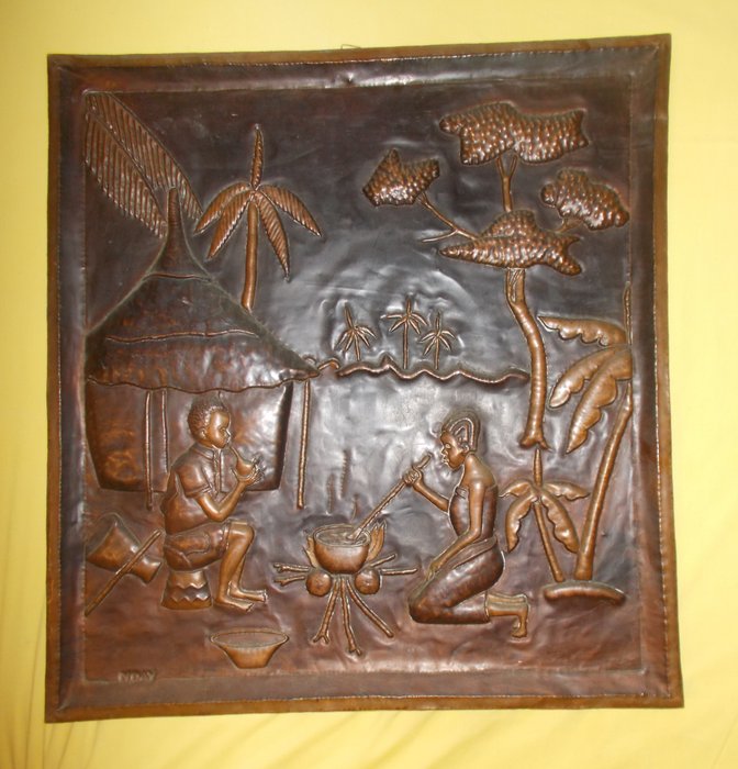 A large African painting in hammered copper signed Nday.