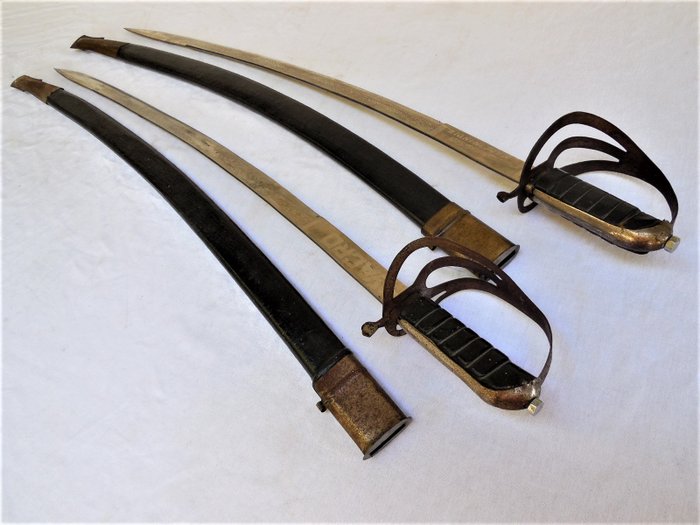 Two large old Indian swords / cavalry sabres with double-sided blade engraving and scabbards