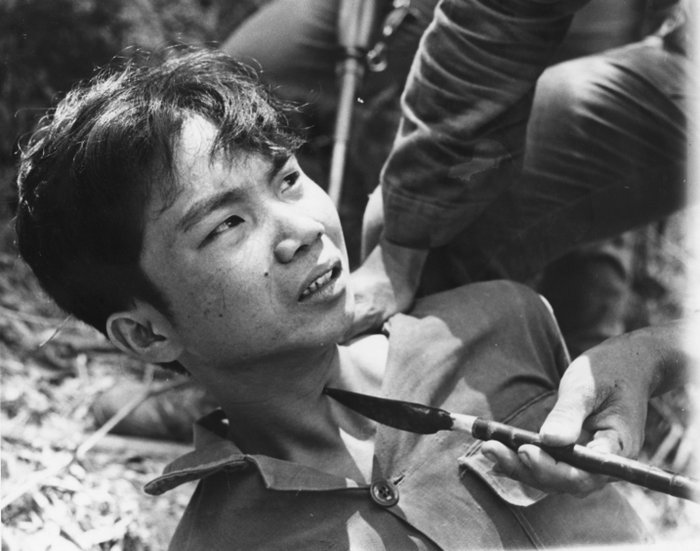 Unknown - Suspected Vietcong with a spear tip in his throat, Vietnam, 1965