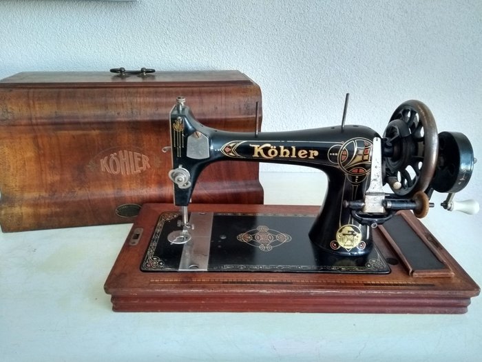 A beautiful old Köhler sewing machine with a wooden dust cover, 1920s