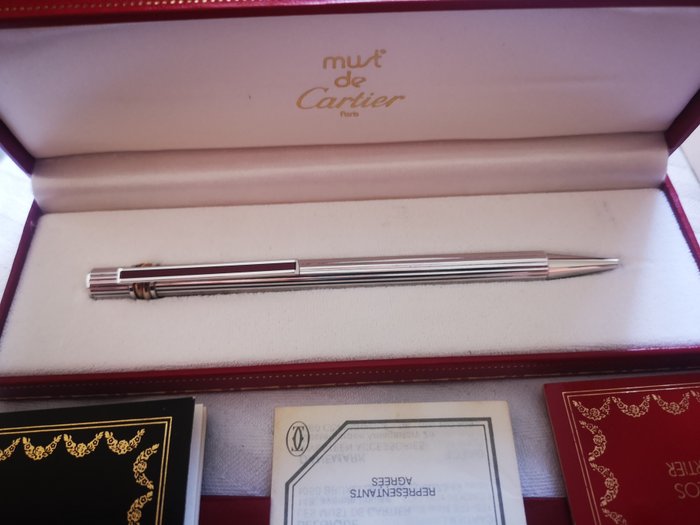 Must de Cartier silver ballpoint pen with three rings in gold