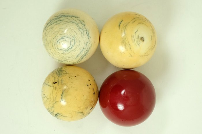 Set of 3 ivory billiard balls with a newer plastic ball - ca. 1900