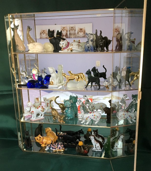 A Gilded Display Case Cabinet With A Collection Of 28 Catawiki