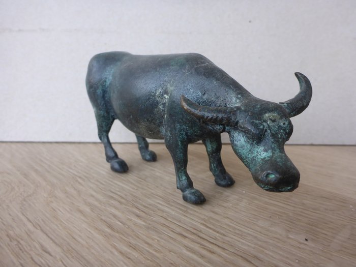 Bronze statue depicting a water buffalo