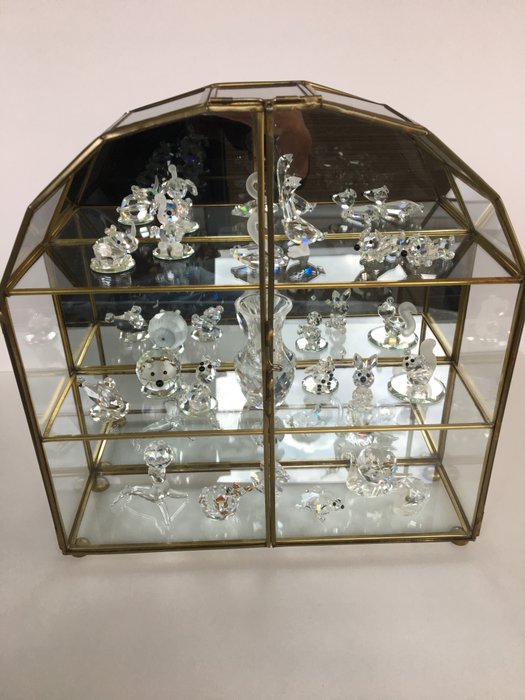 19 crystal figurines + display case (including Swarovski)