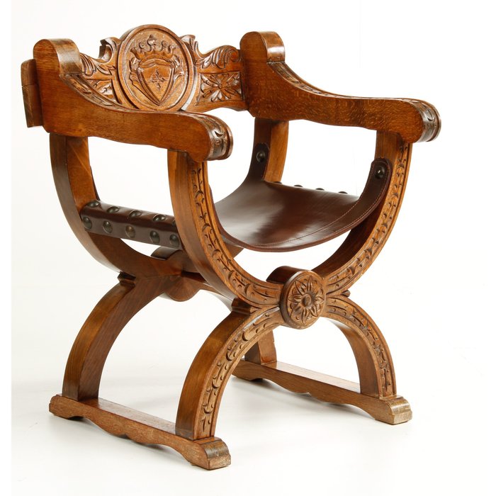 Curule chair with richly decorated wood carving