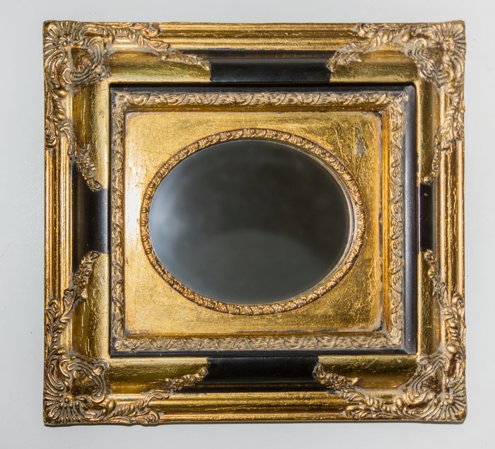 Oval mirror with frame carved and gilded by Biggs & Sons. Carvers, Gilders and Picture restorers. London