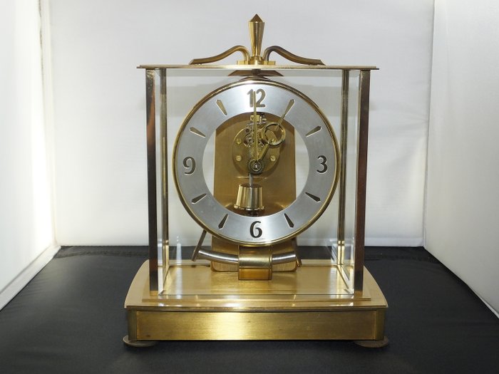 Kundo (electronics) clock working perfectly. - Brass, Glass - First half 20th century