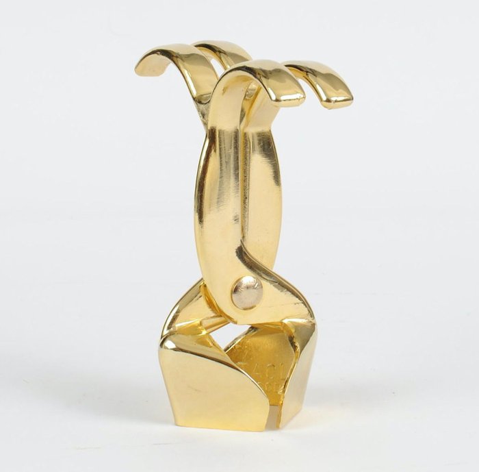 CADO  - Um saca-rolhas para uma garrafa de champanhe. (1) - Arte déco - Um metal dourado