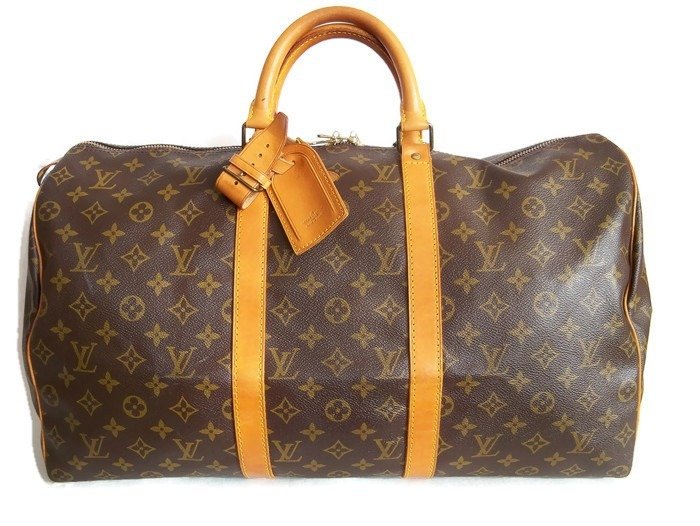 Louis Vuitton - Keepall 50 Luggage bag + LV accessories - - Catawiki