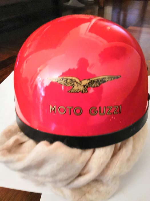 Sponsored red helmet by Moto Guzzi