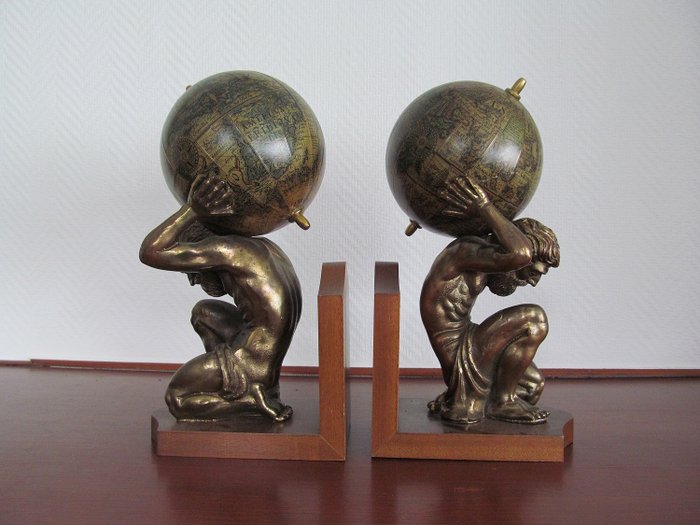 2 Bookends - Atlas with a globe on the shoulders - Various materials are burned