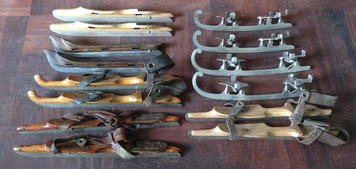 Seven pairs of beautiful antique skates, made around 1920-1940 - wood and iron