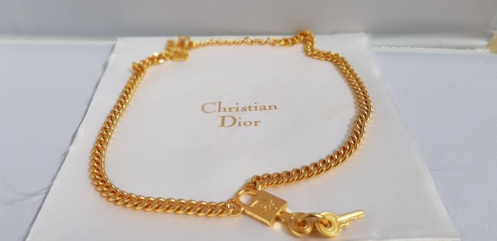 gold dior lock necklace