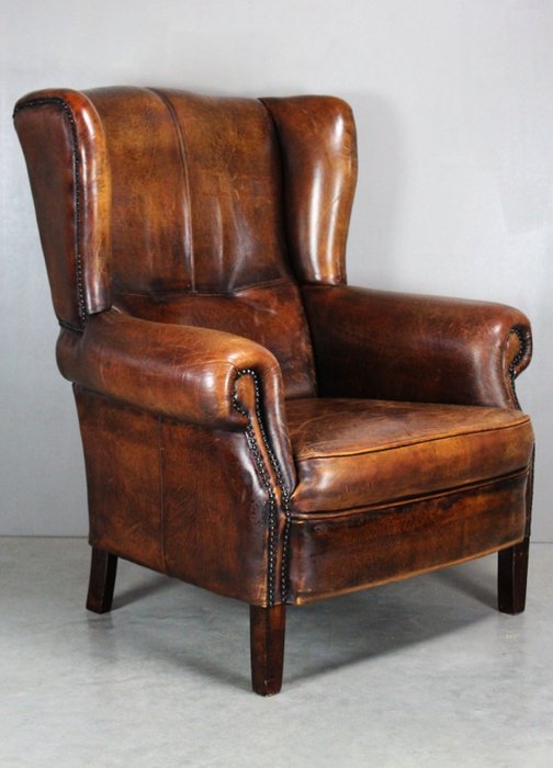 Vintage English classic sheep leather wingback armchair with copper nails