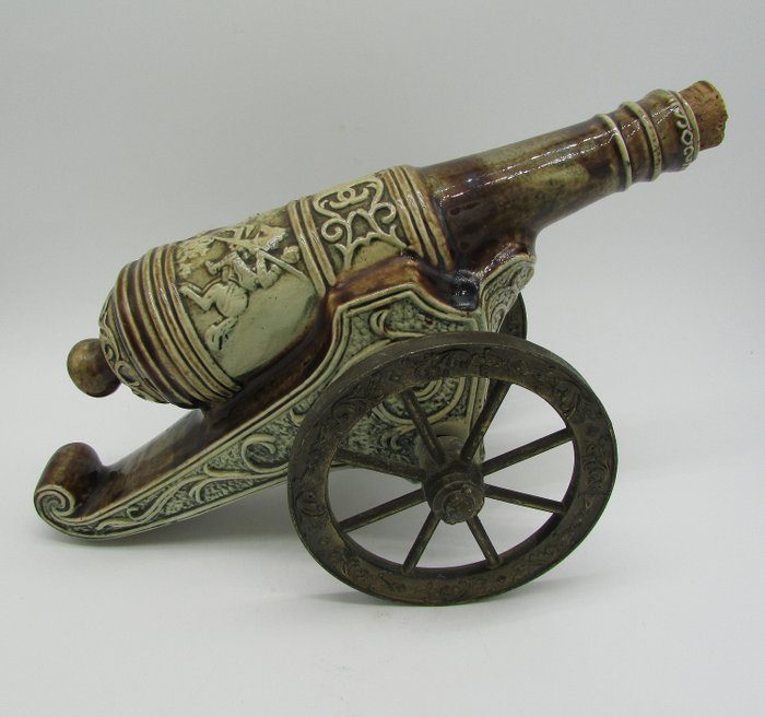 cannon bottle of liquor - ceramic and metal