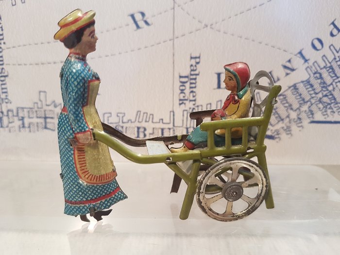 Meier/Gesch - brinquedo de lata, penny toy Lady pushing Child in cart - 1910-1919 - Alemanha