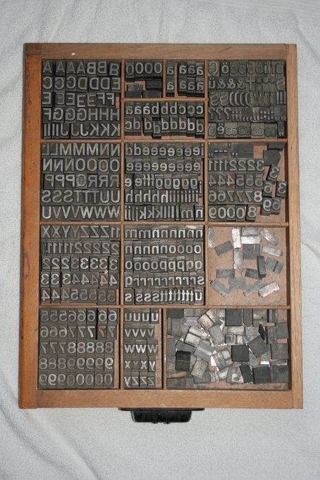 Letter tray filled with lead letters - Lead, Wood