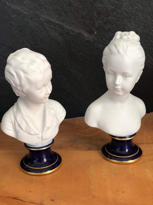 Lot - A pair of Tharaud Limoges porcelain busts, 15 3/4 in. (40 cm) h.